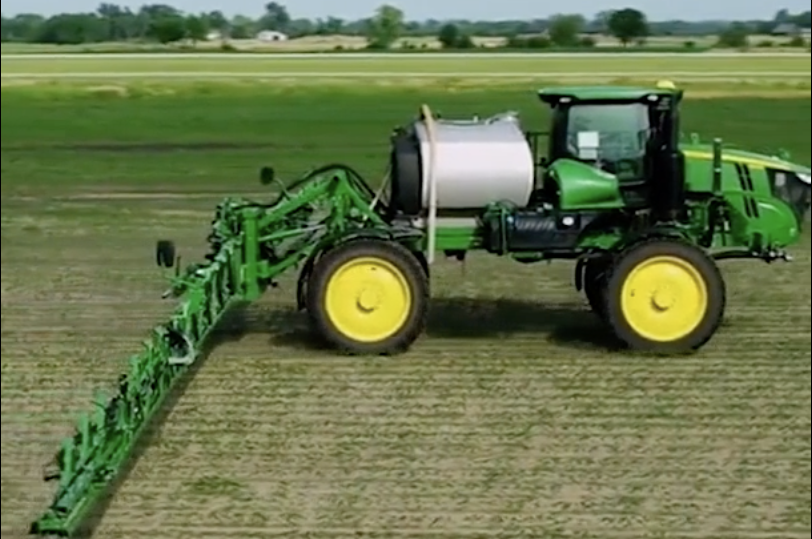 A John Deere tractor with See & Spray attachment.